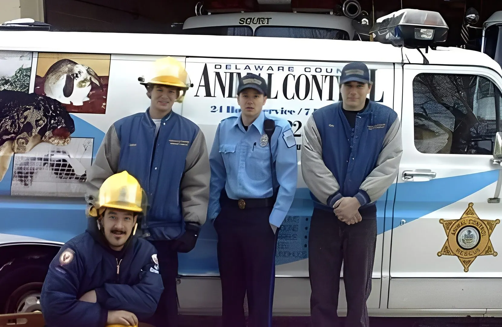 Animal control team in front of van