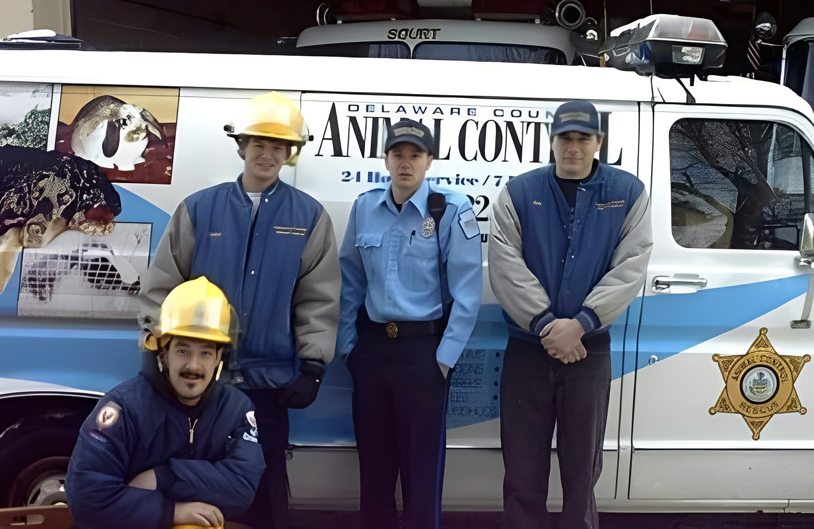 Animal control team in front of van